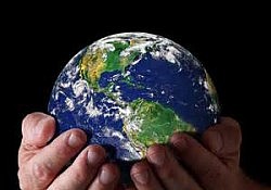 image of hands holding Earth