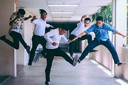 Group of people doing jump shot